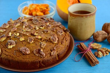 Pumpkin walnut cinnamon chocolate cake served with hot chocolate drink