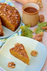 Pumpkin walnut cinnamon chocolate cake served with hot chocolate drink