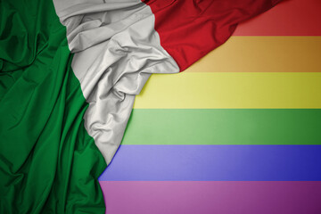 waving national flag of italy on a gay rainbow flag background.