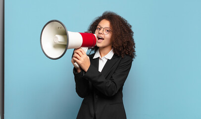 pretty afro teenager business girl with a megaphone