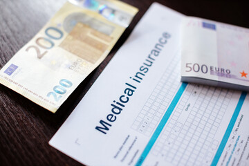 medical insurance policy. Stethoscope and health insurance form. claim form. Blood Pressure Monitor.