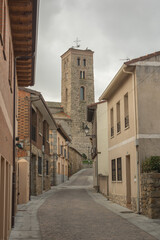Buitrago del Lozoya street, with the church tower at the end.

