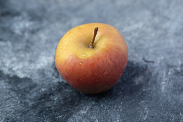 A fresh red apples on a marble background