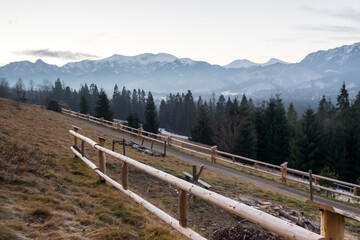 Fototapeta na wymiar December Tatra Mountains with a wooden fence
