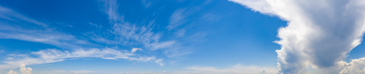Scenic view of blue sky with fluffy clouds. Panorama