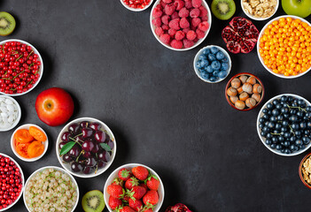 Healthy food with a high content of vitamins and antioxidants: berries, nuts, fruits. Copy space