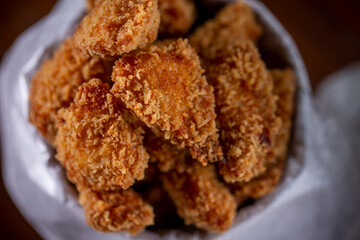 Fried chicken snacks in a wooden background
