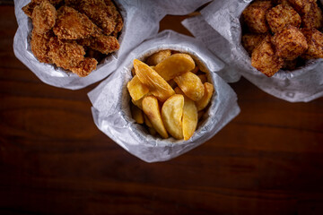 Fried snacks menu: potato, chicken, tapioca cubes and onion rings.