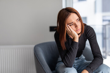 Obraz premium Depression woman sit on the chair at home