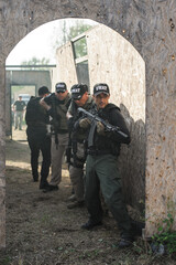 Military army soldiers in action tactical combat shooting from rifle machine gun. Shooting and...