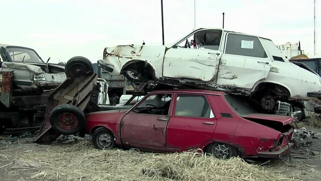 Old Vintage Rusted Cars at a Scrap Yard.  