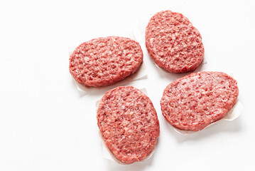  Raw minced homemade cutlets, on the white background