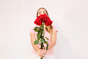 woman and a bouquet of red roses