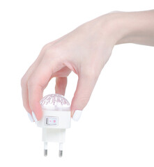 Lamp night light in the socket in hand on white background isolation