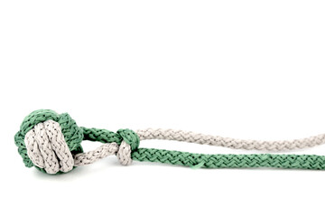 Thick knot woven from gray and green paracord isolated on white background