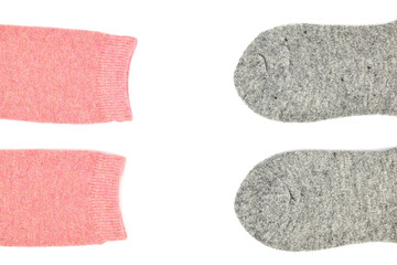 Two pairs of woolen socks, pink and gray, isolated on white