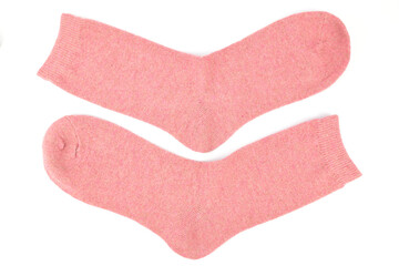 Pair of pink warm woolen socks isolated on white background