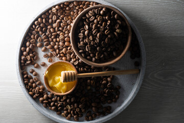 honey and coffee beans on wood background, abstract