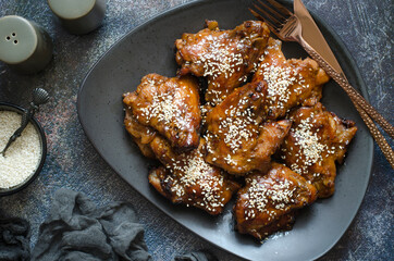 Baked chicken wings in honey and soy sauce glaze
