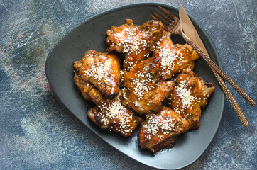 Baked chicken wings in honey and soy sauce glaze