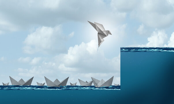 Change and success as a business leadership and leader concept as a paper boat rising as a bird in flight to a higher level as corporate progress and overcoming difficulty with creative ideas