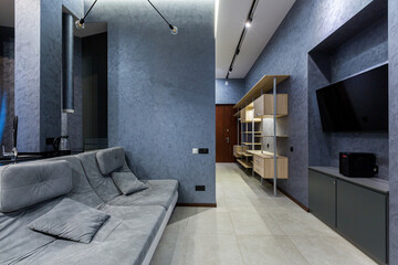 interior photography, large kitchen studio together with living room in loft style, in dark colors