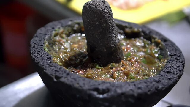 Close-up of traditional Mexican molcajete full of sauce