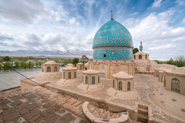 Blue dome of Vali Shrine mosque viewed from a rooftop. On the rooftop of Shah Nematollah Vali Shrine, Mahan, Iran.