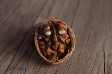 Fototapeta na wymiar relief walnut with an unusual shape on a wooden board