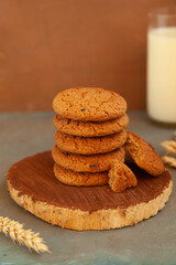 Homemade chocolate chip cookies stacked in a rusty setting