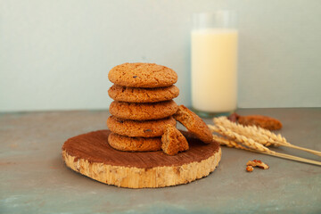 Homemade chocolate chip cookies stacked in a rusty setting