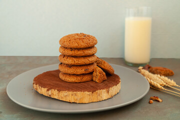 Homemade chocolate chip cookies stacked in a rusty setting