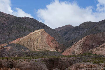 High in the cordillera. View of the colorful mountains, rocky cliffs and precipice.
