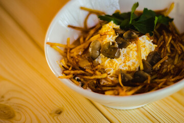 salad with fried fries and mushrooms and chicken