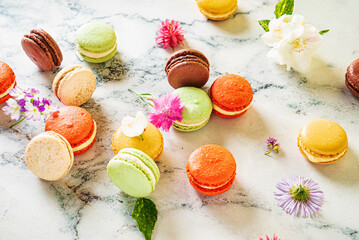 colorful macaroons on the marble background