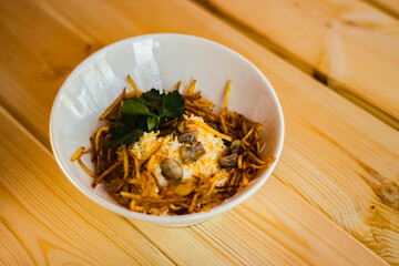 salad with fried fries and mushrooms and chicken