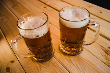 glass of beer on wooden table
