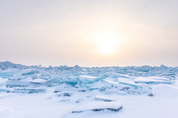 Fototapeta na wymiar Sunrise over the blue ice formation in Mackinaw City