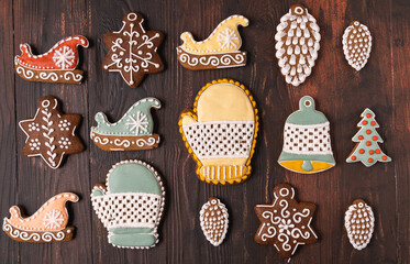 Panorama Christmas Gingerbread on wooden brown background, flat lay.
