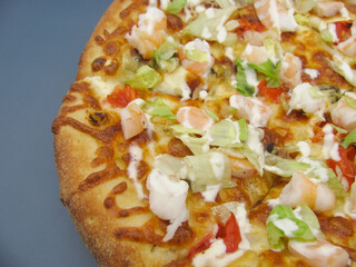 Whole fresh pizza with shrimp and cream sauce