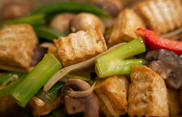 Close up of a fresh vegetarian thai meal with tofu and vegetables