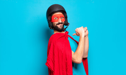 young bearded man. crazy and humorous super hero with helmet and mask
