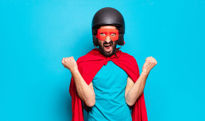 young bearded man. crazy and humorous super hero with helmet and mask