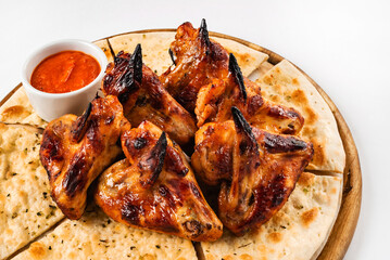 tasty grilled chicken wings with sauce