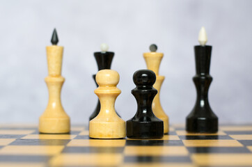 Chess board with black and white chess pieces, selective focus