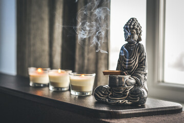 Candlestick in the shape of a buddha