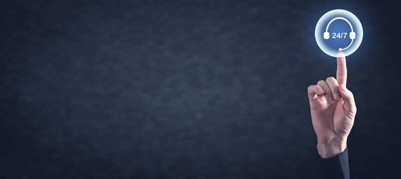 Male hand touching 24/7 Support button. Call Center