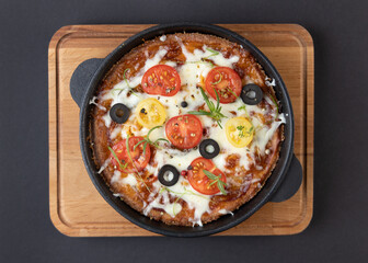 Low-carb keto diet Pizza with mozzarella and tomato crust with cheese filling. Low carb keto diet cake made from almond flour and mozzarella instead of classic pizza.