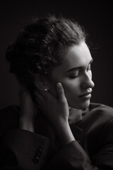 Black and White Portrait of Beautiful young curly woman.