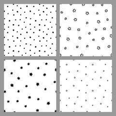 Black confetti stars on white background. Vector set of seamless textures. Random star confetti seamless patterns.  Card templates.